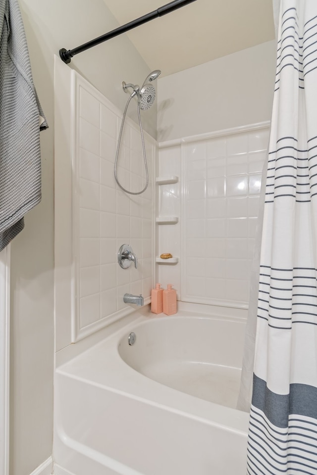 bathroom with shower / bath combo