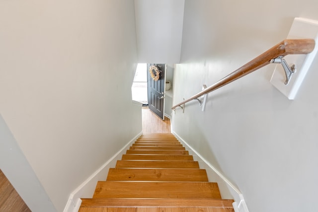 stairway featuring hardwood / wood-style flooring