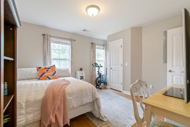 bedroom with hardwood / wood-style floors