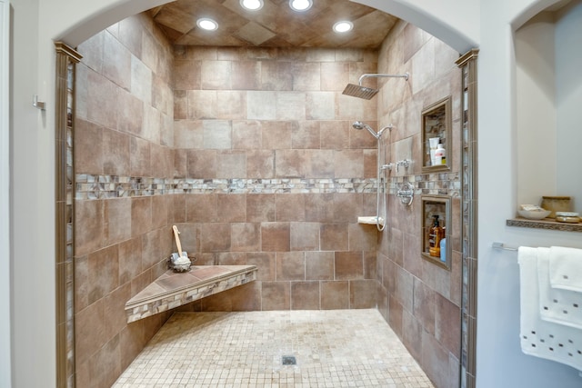 bathroom with a tile shower