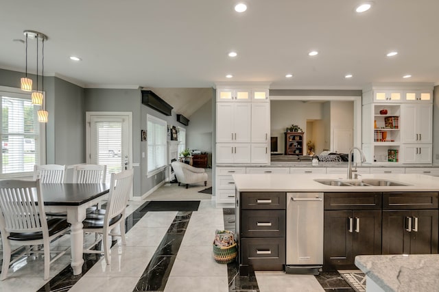 kitchen with sink, pendant lighting, light tile patterned flooring, and a wealth of natural light