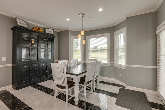 dining space featuring ornamental molding and light tile patterned floors