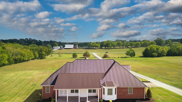 birds eye view of property with a rural view