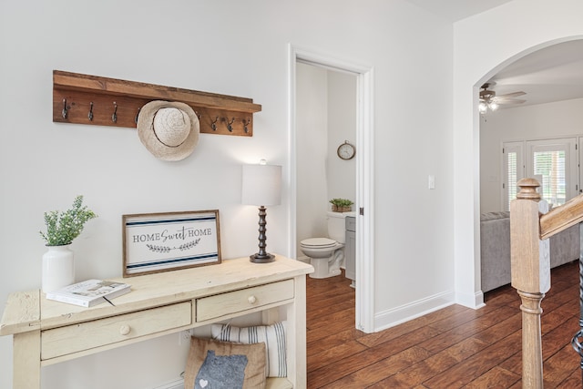 corridor featuring dark hardwood / wood-style floors