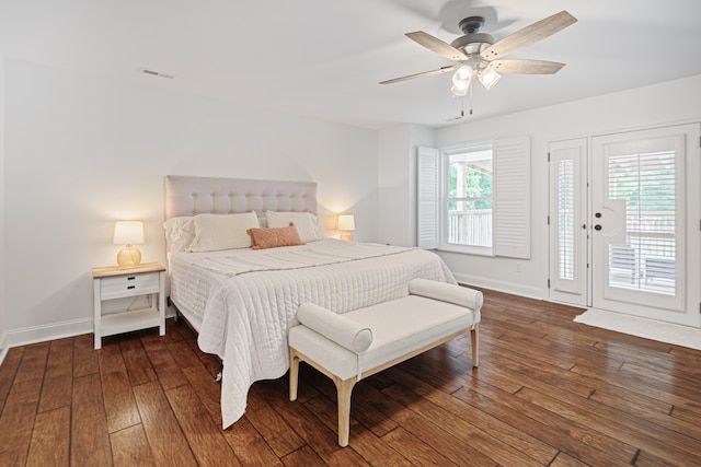 bedroom featuring ceiling fan, access to outside, hardwood / wood-style flooring, and multiple windows