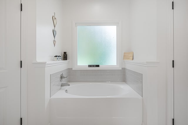 bathroom featuring a washtub