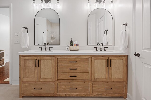 bathroom with vanity and wood-type flooring