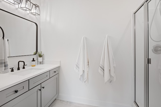 bathroom with tile patterned flooring, an enclosed shower, and vanity