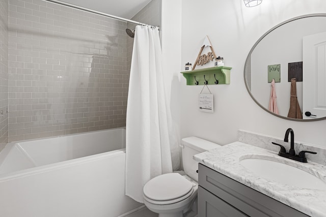 full bathroom featuring toilet, vanity, and shower / bathtub combination with curtain