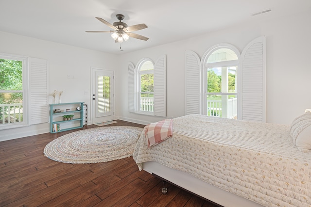 bedroom with ceiling fan and dark hardwood / wood-style floors