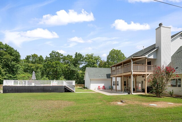 view of yard with a deck and a patio area