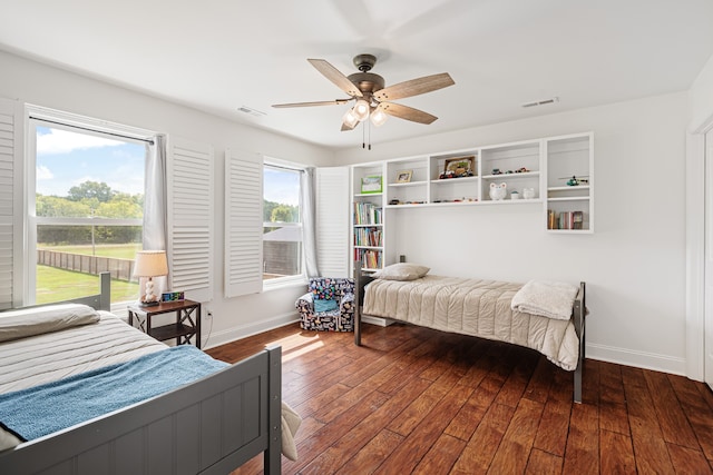 bedroom with ceiling fan and hardwood / wood-style floors