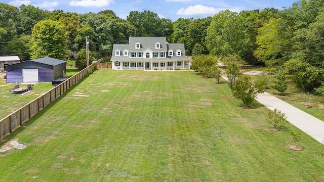 exterior space with a lawn, an outdoor structure, and a garage