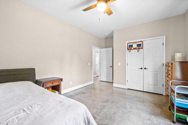 bedroom with ceiling fan and a closet