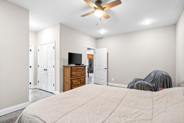 carpeted bedroom featuring ceiling fan