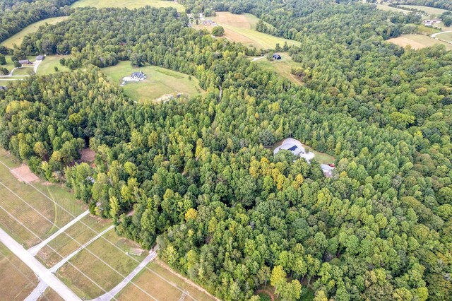 birds eye view of property with a rural view