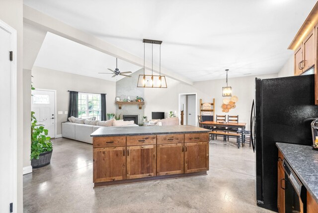 kitchen featuring ceiling fan, pendant lighting, lofted ceiling with beams, and black fridge