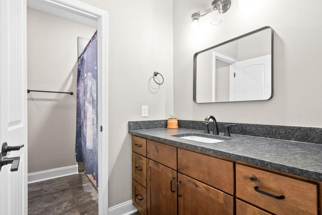 bathroom featuring tile patterned floors and vanity