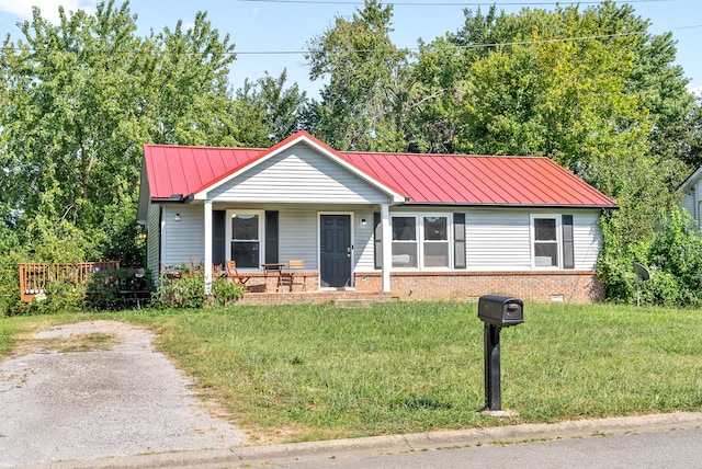 ranch-style home with a front lawn