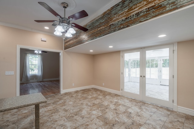 tiled empty room featuring ceiling fan, crown molding, and french doors