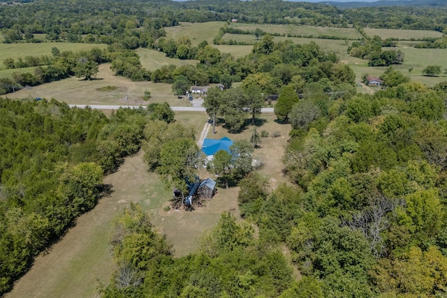 aerial view featuring a forest view and a rural view