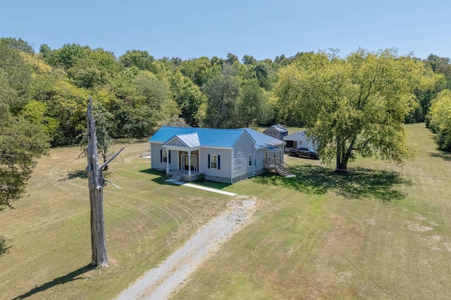 bird's eye view featuring a wooded view