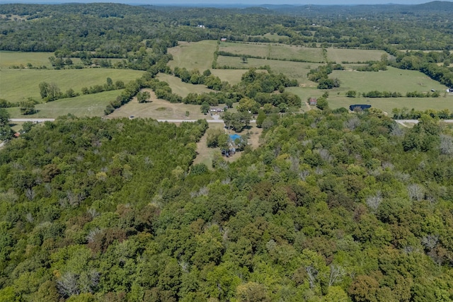 drone / aerial view with a view of trees