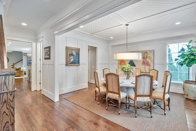 dining area featuring ornamental molding and hardwood / wood-style floors