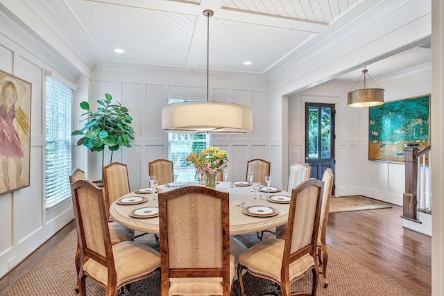 dining room featuring ornamental molding and wood-type flooring