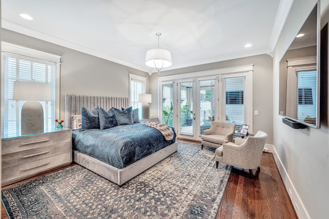 bedroom with crown molding, dark wood-type flooring, and access to exterior