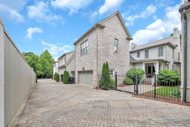 view of side of property with a garage