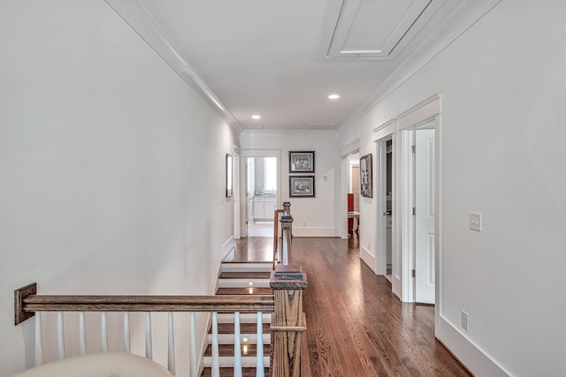 hall featuring dark wood-type flooring and ornamental molding