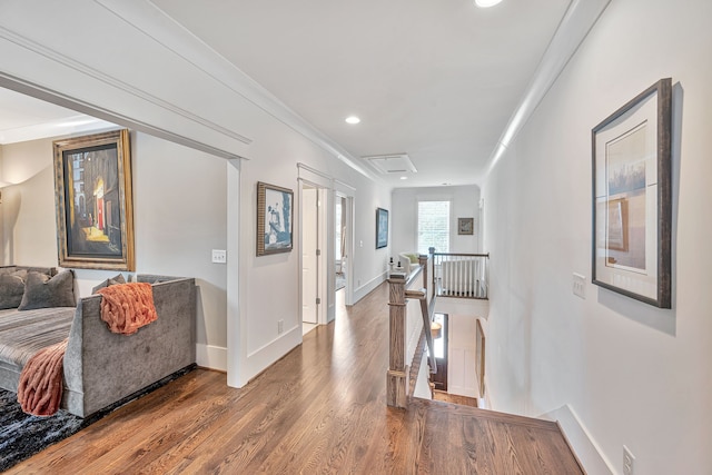 corridor featuring ornamental molding and hardwood / wood-style floors