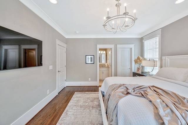 bedroom featuring ornamental molding, dark hardwood / wood-style flooring, and ensuite bath