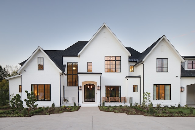 modern inspired farmhouse with covered porch