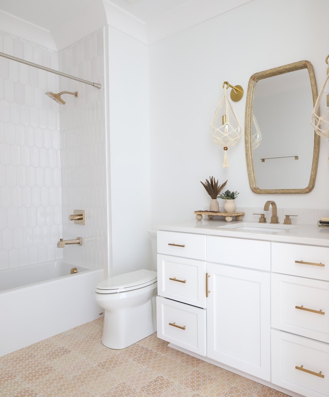 full bathroom featuring toilet, vanity, ornamental molding, tile patterned floors, and tiled shower / bath