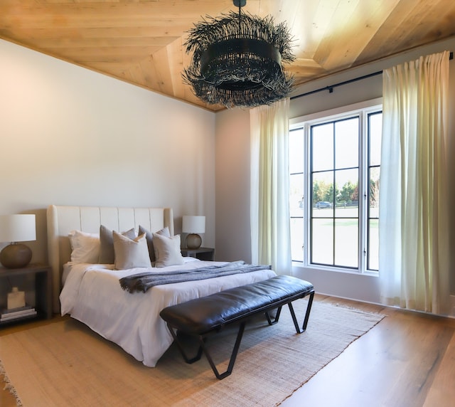 bedroom with hardwood / wood-style floors and wooden ceiling