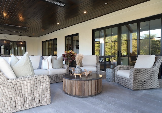 view of patio / terrace with ceiling fan and an outdoor living space