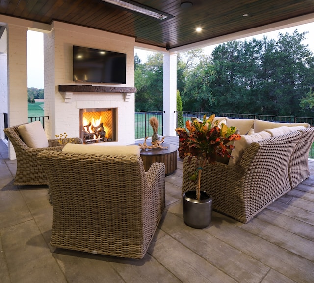 view of patio / terrace featuring an outdoor living space with a fireplace