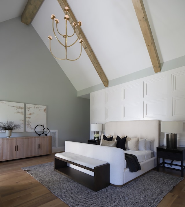 bedroom featuring high vaulted ceiling, beam ceiling, a notable chandelier, and wood-type flooring