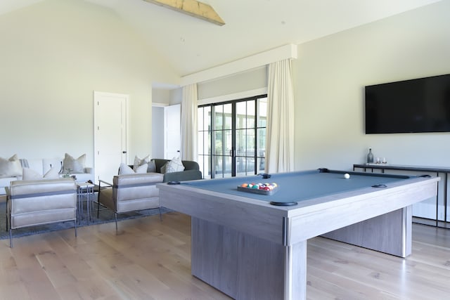 game room with light wood-type flooring, beam ceiling, high vaulted ceiling, and billiards