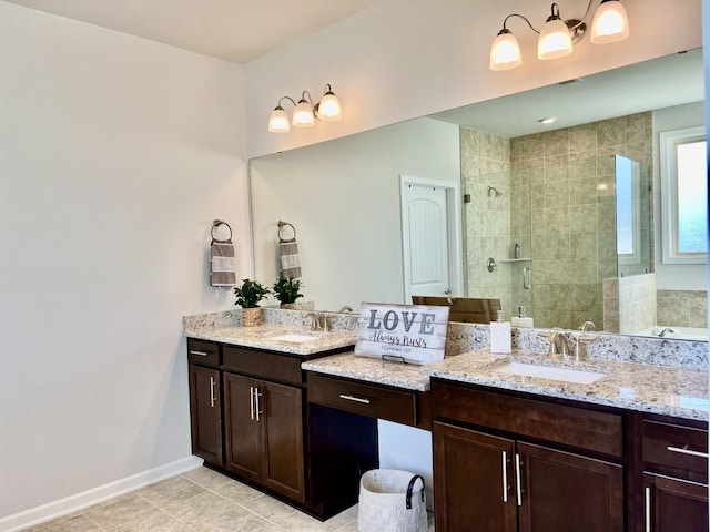 bathroom with vanity, a shower with shower door, and tile patterned floors