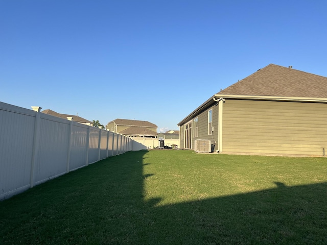 view of yard featuring central air condition unit