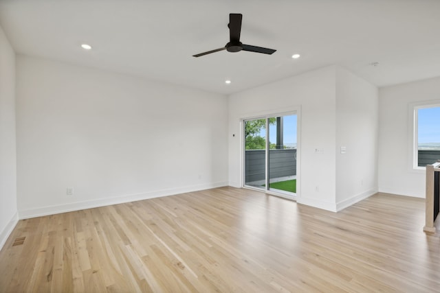 unfurnished room featuring ceiling fan and light hardwood / wood-style flooring