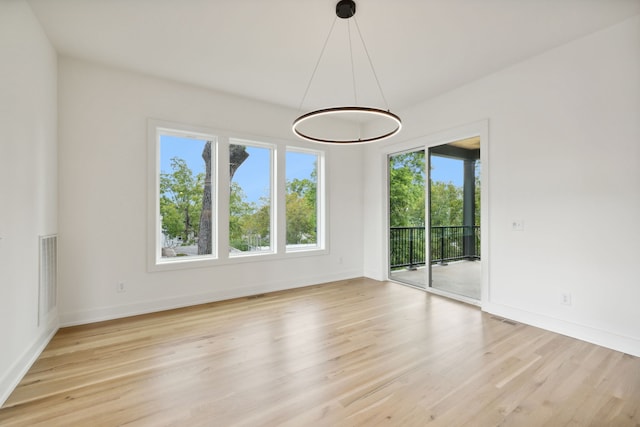 spare room with light wood-type flooring