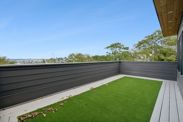 view of yard with a balcony