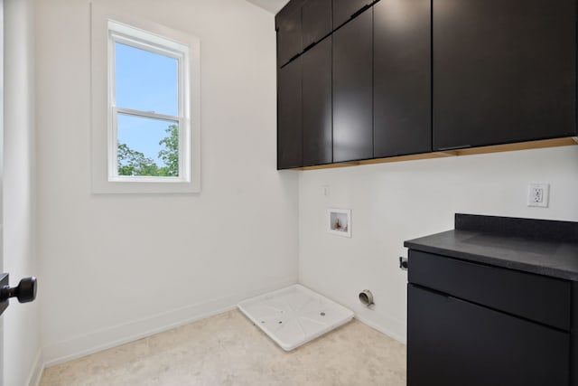 laundry area featuring a wealth of natural light, electric dryer hookup, cabinets, and hookup for a washing machine