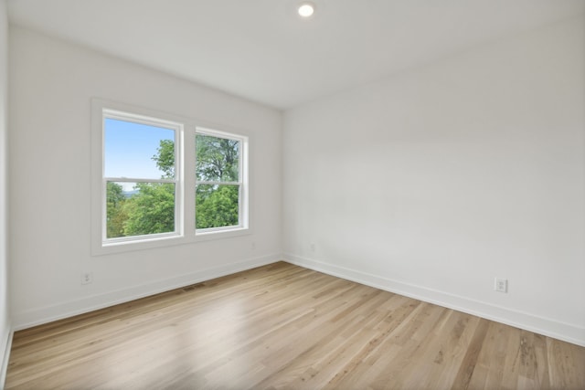 spare room with light wood-type flooring