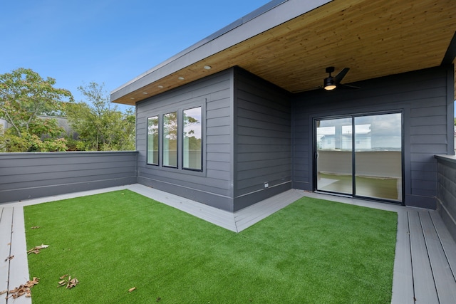 exterior space with ceiling fan