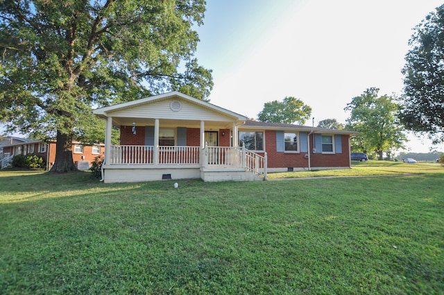 view of front of house featuring a front yard and covered porch